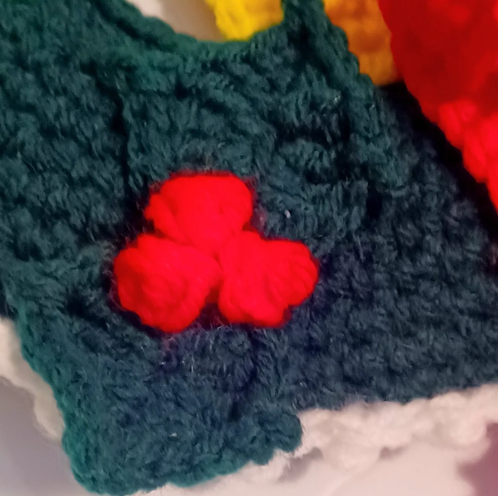 Crocheted Christmas Wreath with Candle, Bow, and Holly Berries